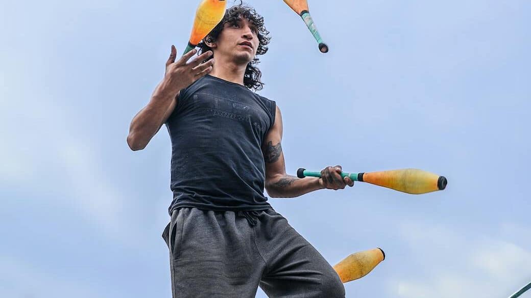 highline performer juggling in peru cityscape