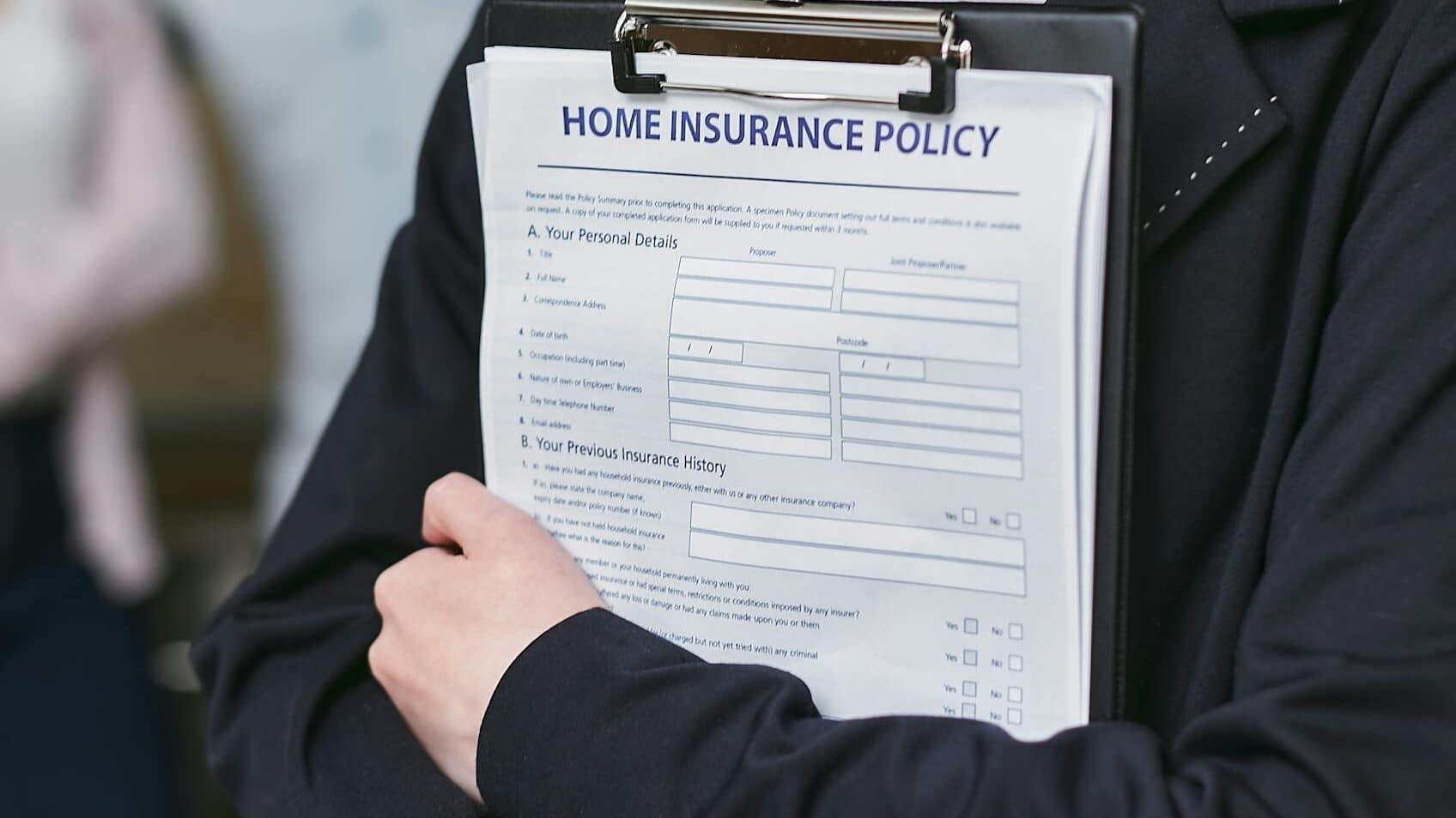 person holding insurance policy contract