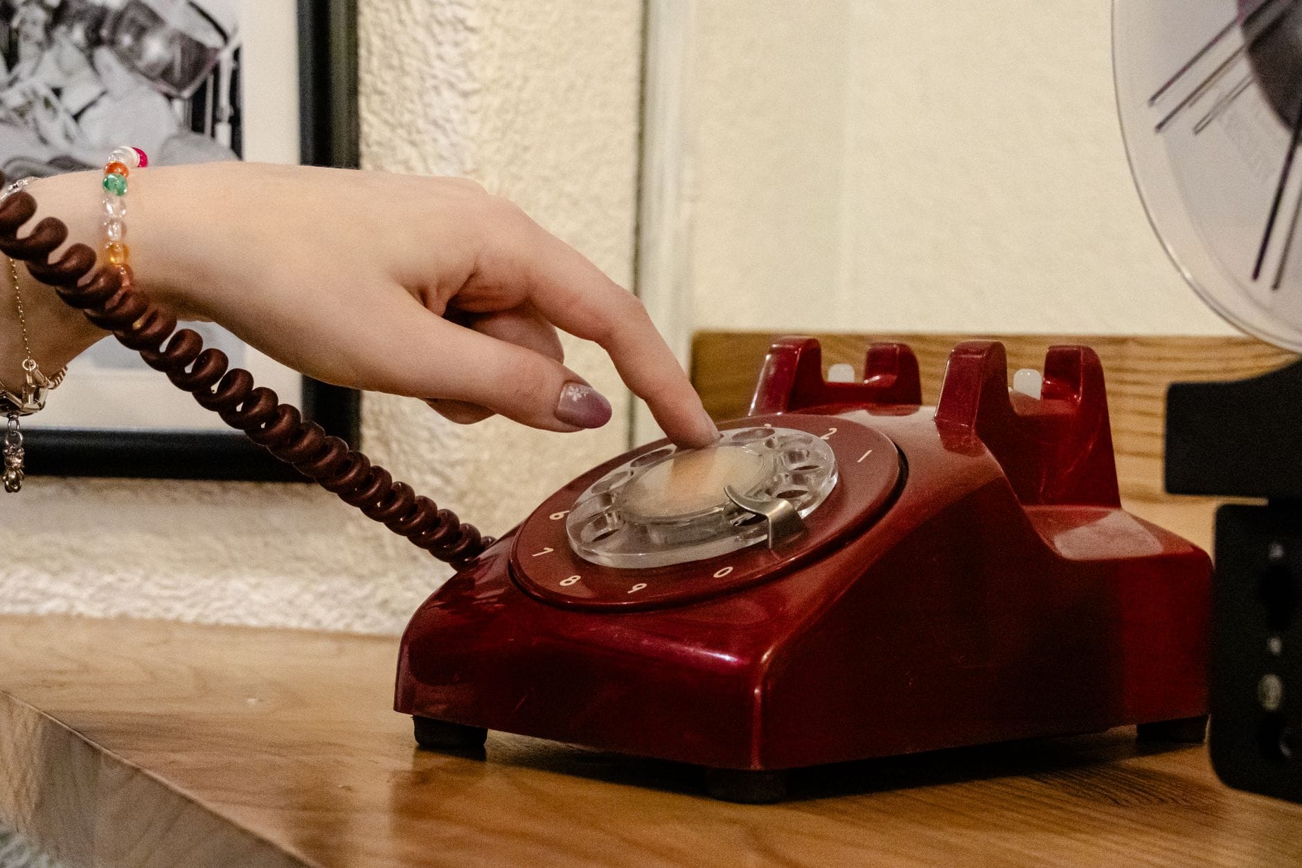 hand dialing vintage red rotary telephone